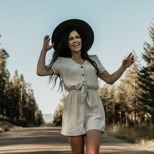 Cream Romper with tie front & peek a boo waist